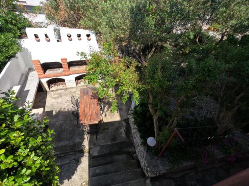 an overhead view of a bench and a table at Apartmani Daniela in Rab