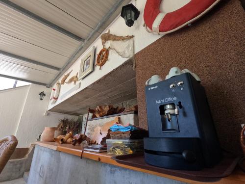 a counter with a toaster on top of it at Apartmani Daniela in Rab