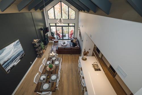 an overhead view of a dining room with tables and chairs at Tremblant Prestige - Verbier 8-202 in Mont-Tremblant