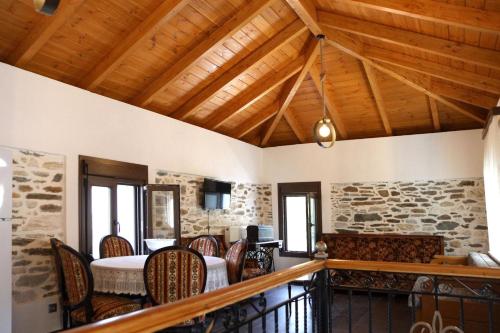 a dining room with a table and chairs at Archontiko Nikolaou Keramidi in Keramídhion