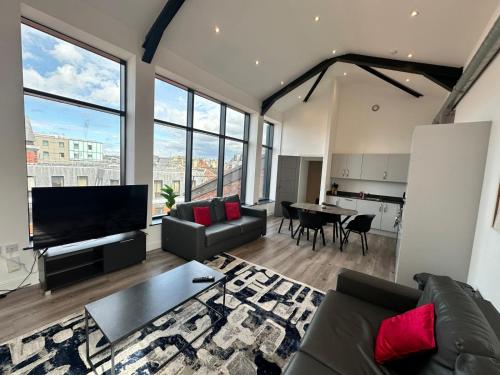 a living room with a couch and a table at Dale Street Apartments Liverpool by Beehosting in Liverpool