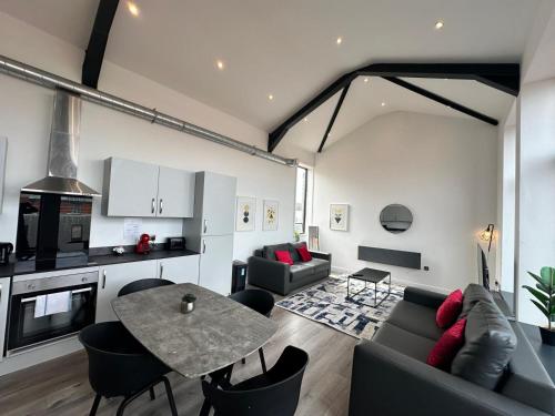 a living room with a couch and a table at Dale Street Apartments Liverpool by Beehosting in Liverpool