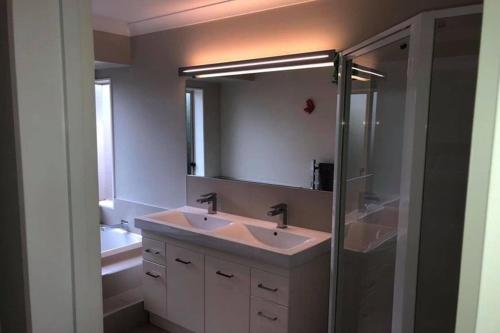 a bathroom with a sink and a shower at Quiet and comfortable in Hamilton