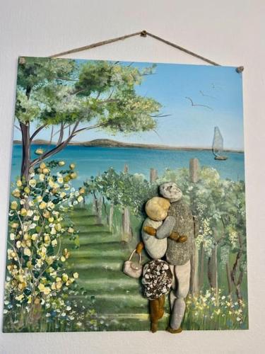 a painting of two teddy bears walking down a path at Tünde NENE Apartman in Zánka
