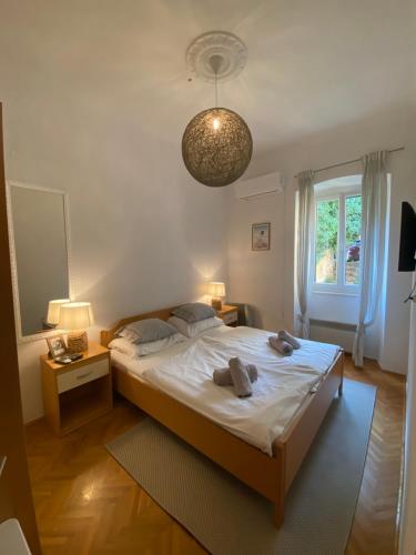 En eller flere senge i et værelse på Maison Riviera Opatija