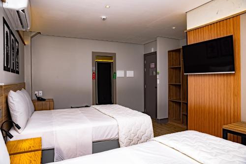 Katil atau katil-katil dalam bilik di Hotel Vila Catavento