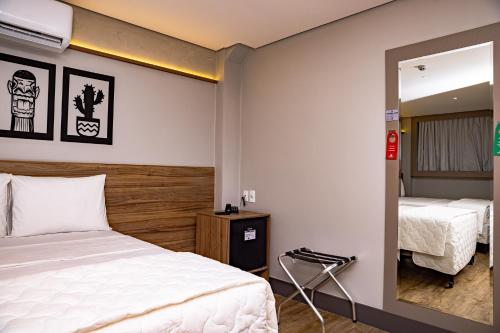 Katil atau katil-katil dalam bilik di Hotel Vila Catavento