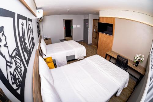 Katil atau katil-katil dalam bilik di Hotel Vila Catavento