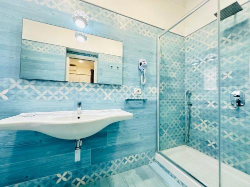a bathroom with a sink and a shower at Sky Ponza - Immobilevante in Ponza