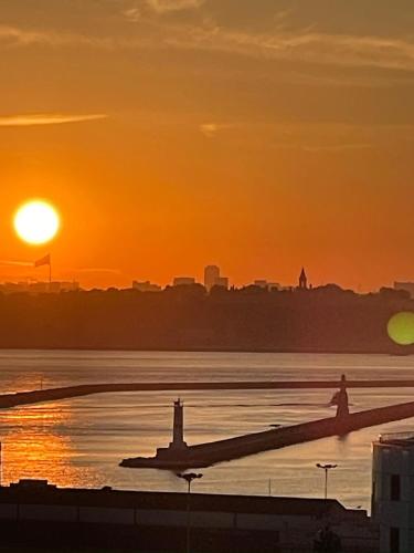 an airplane sitting on the runway at sunset at Fabesco Suite in Istanbul