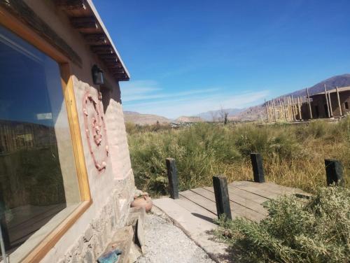 a porch of a house with a view of the desert at Las Ranas in Tilcara