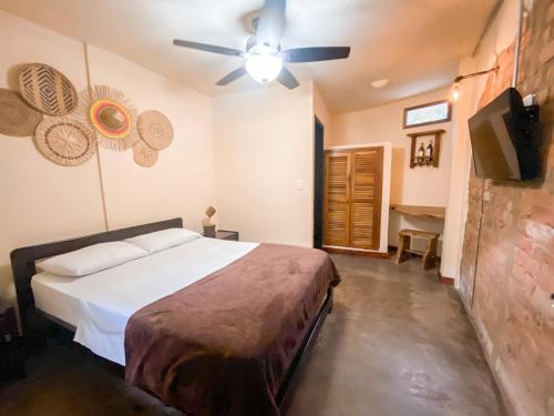 Ένα ή περισσότερα κρεβάτια σε δωμάτιο στο La Rosa Nautica Hostel