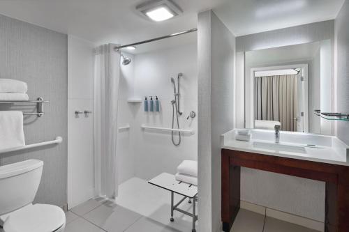 a bathroom with a sink and a toilet and a shower at Residence Inn Atlanta NE/Duluth Sugarloaf in Duluth