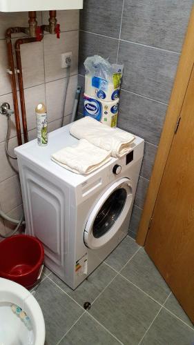 a washing machine sitting on the floor in a bathroom at Istocno Sarajevo, Lukavica, Great View Apartment in Donje Mladice