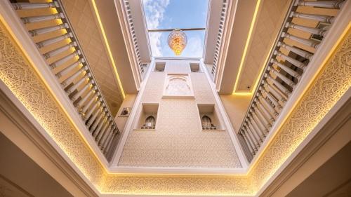 a ceiling view of a building with a window at Riad Luxe Nomade Marrakech & Spa in Marrakech