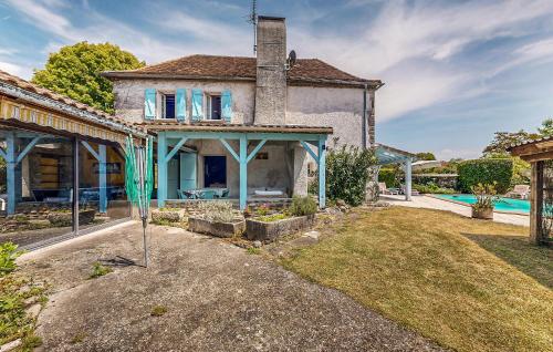 an external view of a house with a swimming pool at 4 Bedroom Stunning Home In Escos in Escos