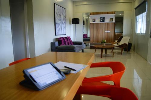 an office with a table with a laptop on it at Z Pad Residences in Tacloban