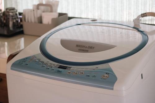 a wii pay machine sitting on a table at Gardenia in Aji