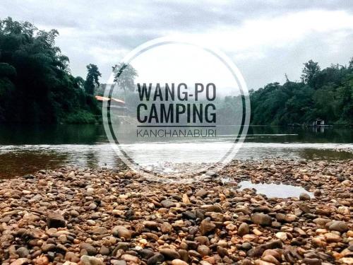 a large group of rocks on the shore of a river at Wangpocamping วังโพแค้มป์ปิ้ง in Ban Wang Pho
