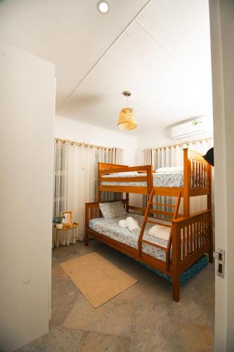 a bedroom with two bunk beds in a room at Bruma Homes in Ponta do Ouro
