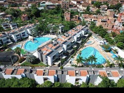 an aerial view of a resort with two swimming pools at Apartasol Ciudadela Santafe in Santa Fe de Antioquia