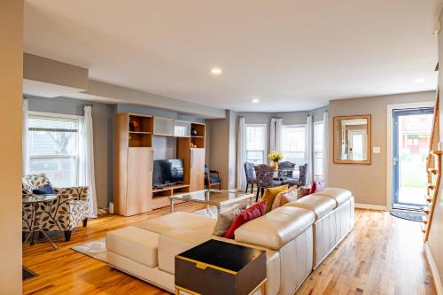 a living room with a couch and a table at Spacious Row Home next Transit near Downtown w Parking in Chicago