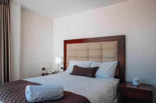 Posteľ alebo postele v izbe v ubytovaní Fratelli Apart Hotel