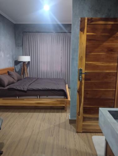 Postel nebo postele na pokoji v ubytování Ubud Bed and Breakfast