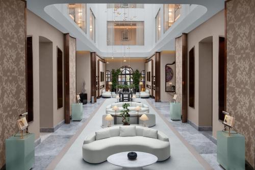 a rendering of a lobby with couches and tables at Sanasaryan Han, a Luxury Collection Hotel, Istanbul in Istanbul