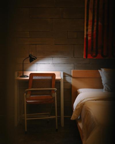 Кровать или кровати в номере Huni Homestay Tembi