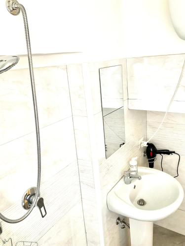 a bathroom with a sink and a shower at Eruption1669 in Catania