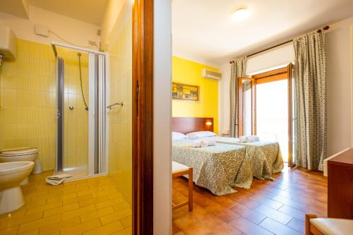 Katil atau katil-katil dalam bilik di Hotel Il Gabbiano