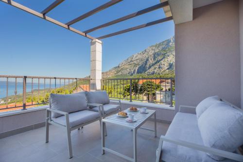 a living room with a view of the ocean at Villa Filia in Tučepi