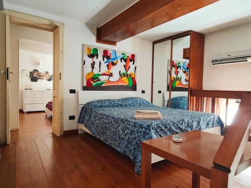 A bed or beds in a room at Appartamento Deluxe Lecce