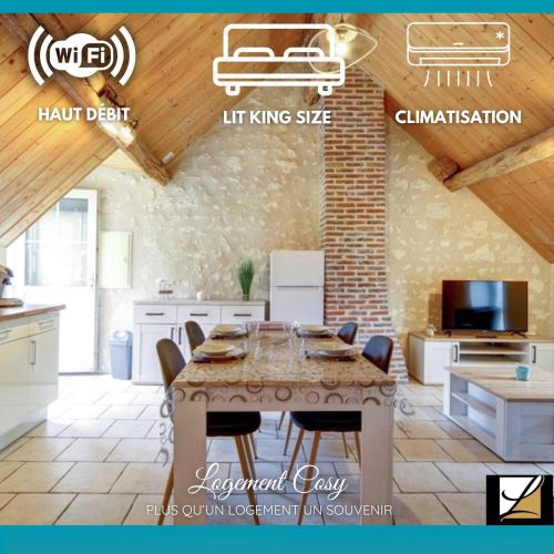 une cuisine avec une table et des chaises dans une pièce dans l'établissement Les logements dans longère de la Gentinière, à Mareuil-sur-Cher