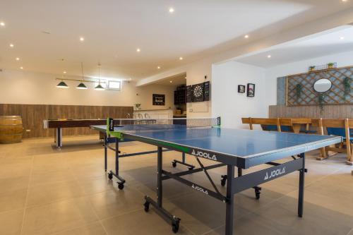 a ping pong table in the middle of a room at Villa Filia in Tučepi