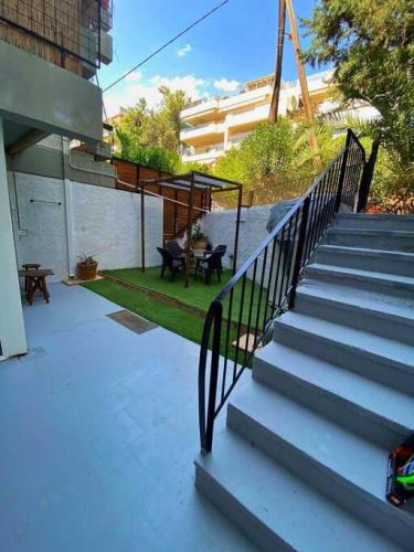 a set of stairs leading up to a building at Sea Urban 4 Varkiza in Vari