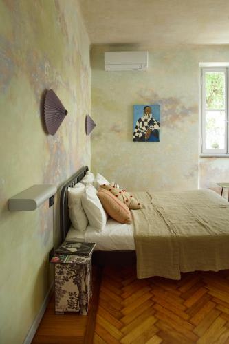 a bedroom with a bed in a room at Zelda in Udine
