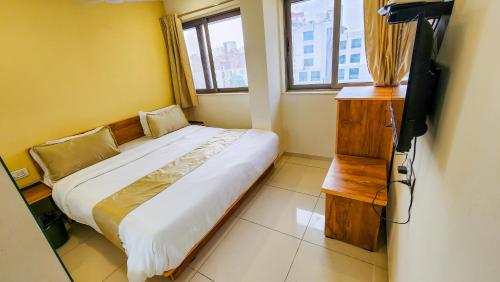 Hotel Nova Safalにあるベッド