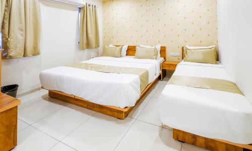Hotel Nova Safalにあるベッド