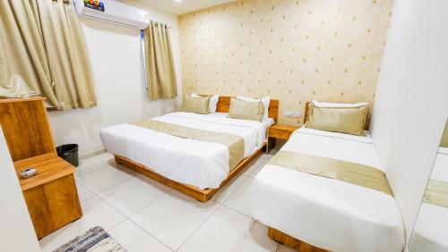 Hotel Nova Safalにあるベッド
