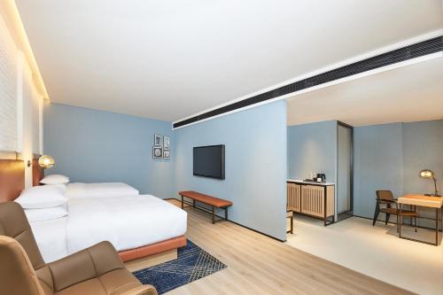 Ένα ή περισσότερα κρεβάτια σε δωμάτιο στο Four Points by Sheraton Changsha, Tianxin