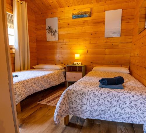 Postel nebo postele na pokoji v ubytování La cabaña de Parisito