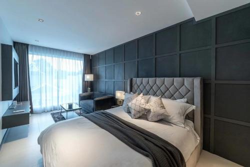 Giường trong phòng chung tại 芭提雅 Olivia Pool Villa