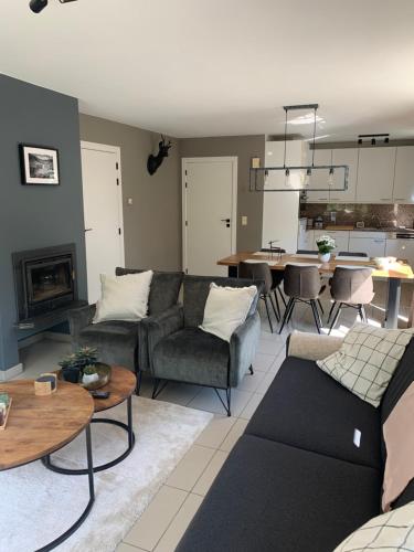 a living room with a couch and a table at Durbuy Dream in Durbuy