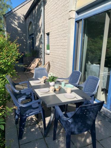 a black table and chairs on a patio at Durbuy Dream in Durbuy