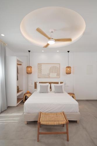 a bedroom with a bed and a ceiling fan at Agia Anna Living in Agia Anna Naxos