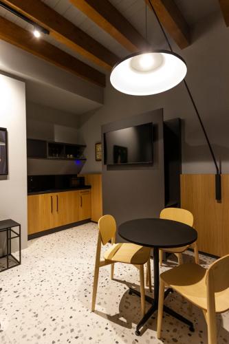 a dining room with a table and chairs at Residenza San Longino in Mantova