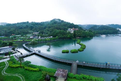 an aerial view of a bridge over a river at Zhaohong homestay in Yuchi