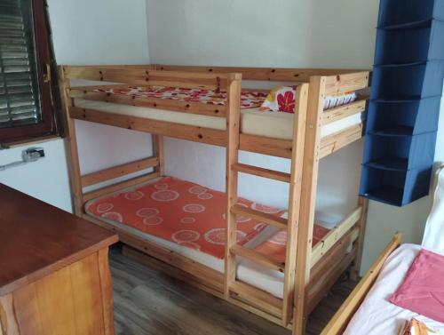 a pair of bunk beds in a room at Small Robinson House 250m to the sea in Peroj